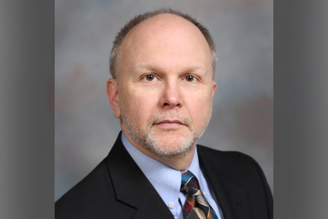 Headshot in a suit and tie